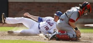 Rob Johnson slides home versus Reds